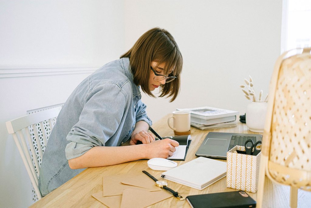 Student writing an original term paper without plagiarism